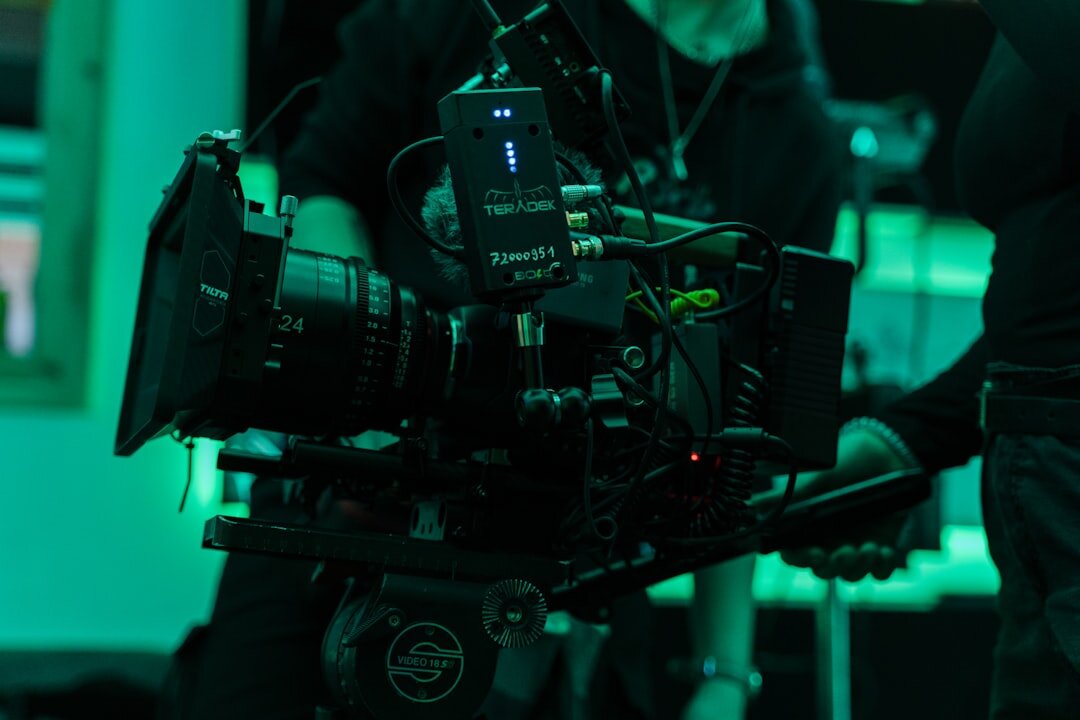 Professional camera operator filming in studio
