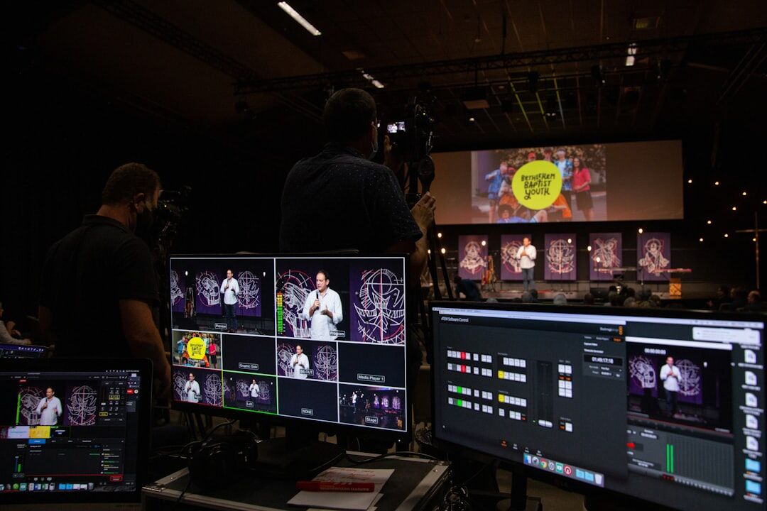 Studio production team collaborating around monitors